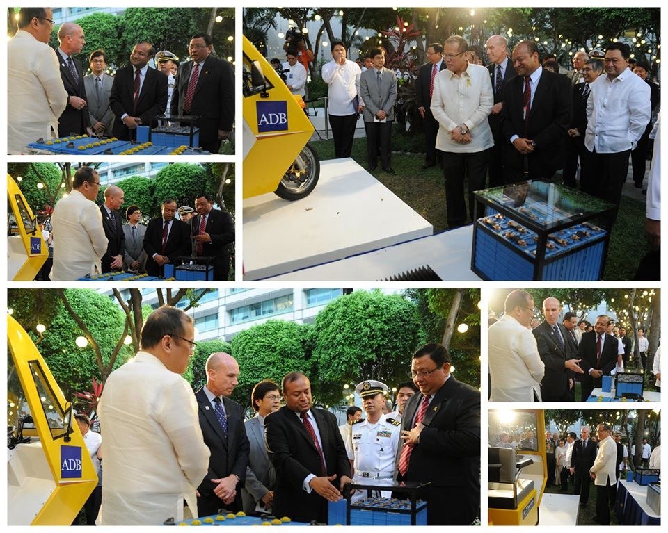 Sohail Hasnie explaining a lithium battery to the President of the Philippines and ministers